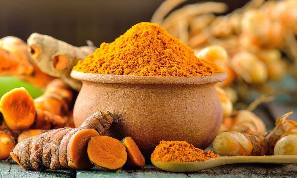 Fresh turmeric arranged on a warm surface